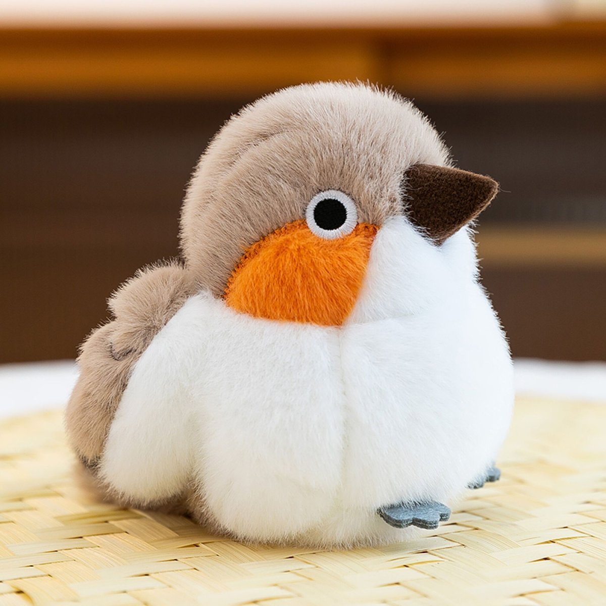 Pájaro beige y naranja
