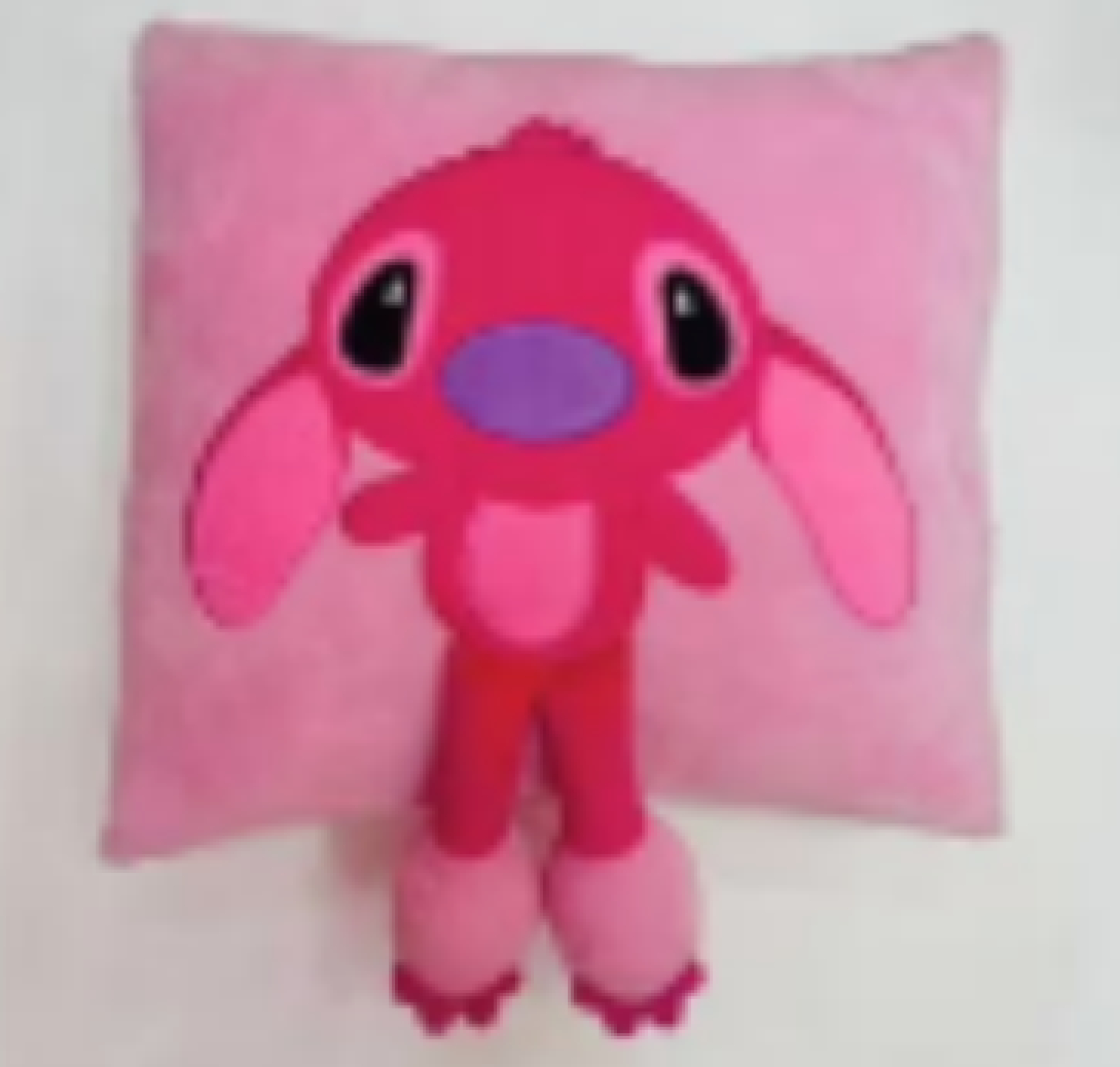 Almohada Stitch y Angel fondo rosa 35cm